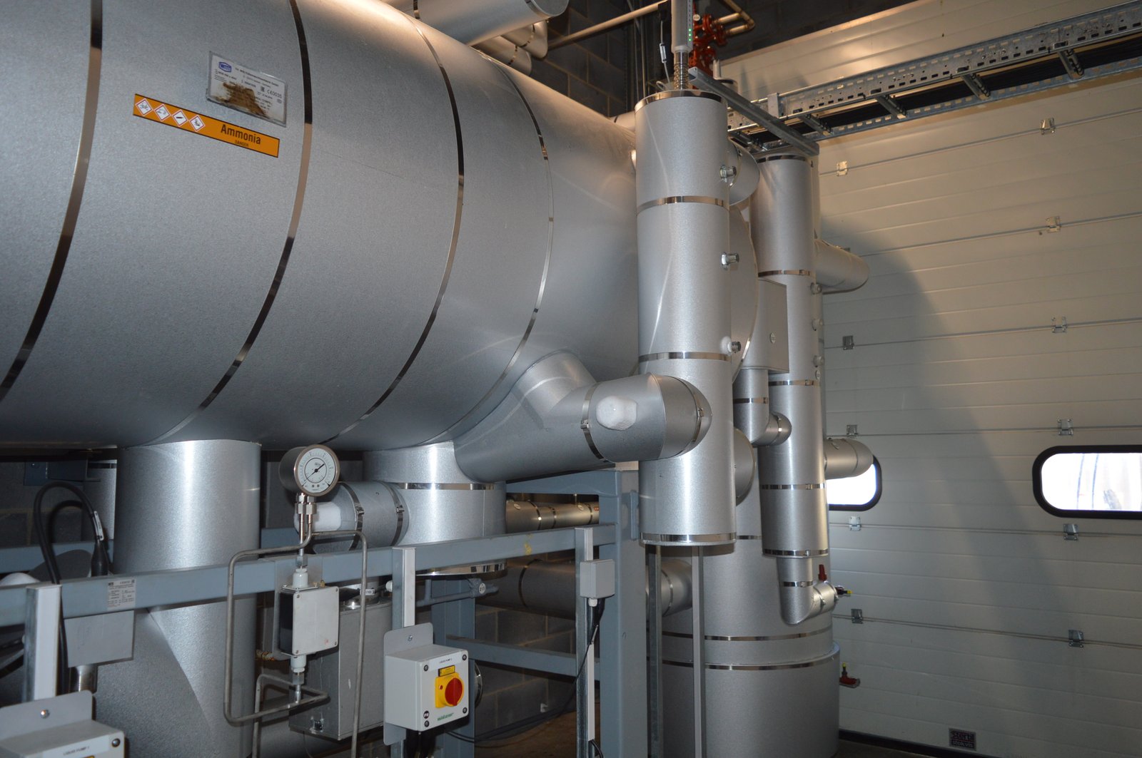Ammonia refrigeration vessel and insulated pipework